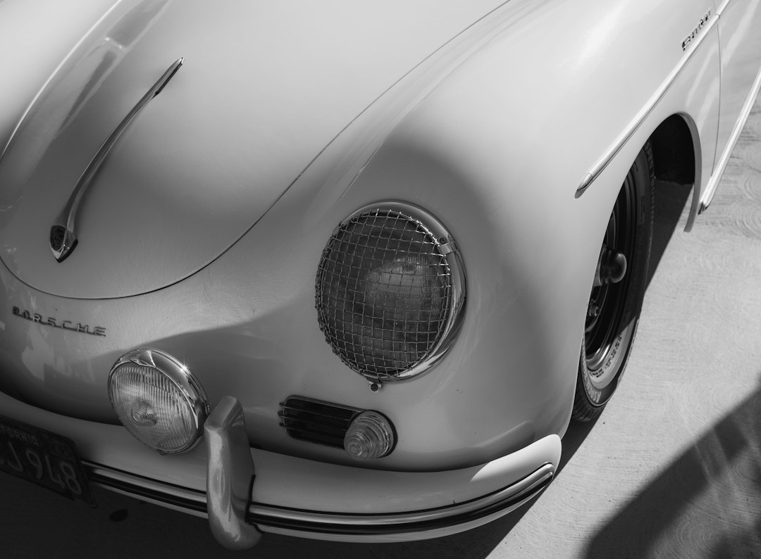 Classic Porsche by Clothing Brands grayscale photography of car headlight