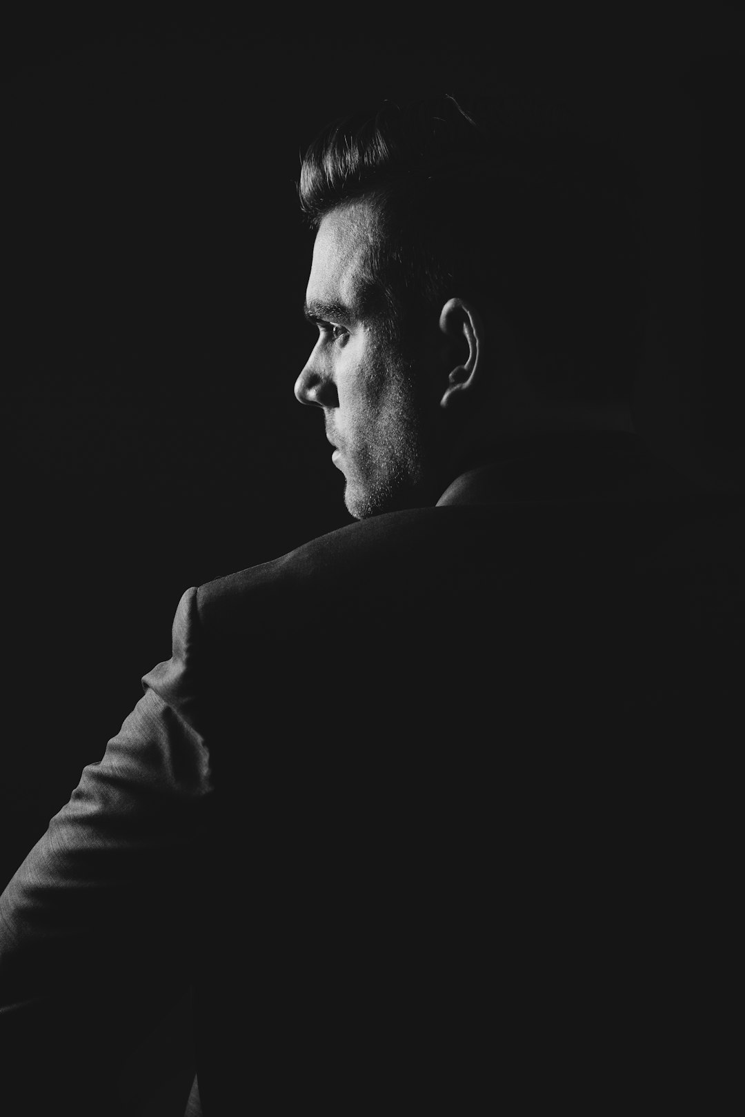 FAQ by Clothing Brands grayscale photo of man wearing blazer