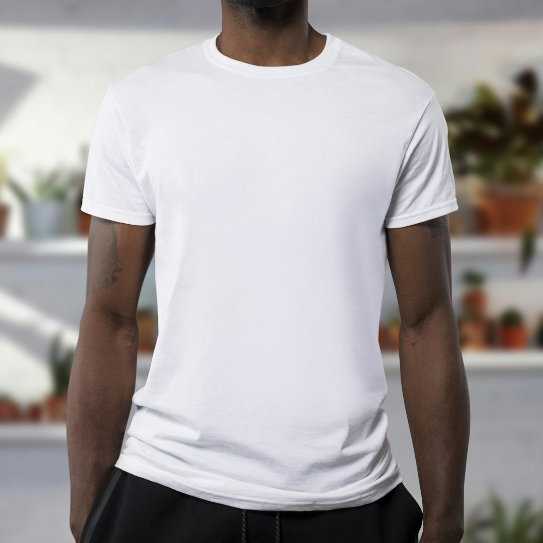 For the hi-res .psd visit mockupdated.com by Clothing Brands man wearing white crew-neck t-shirts