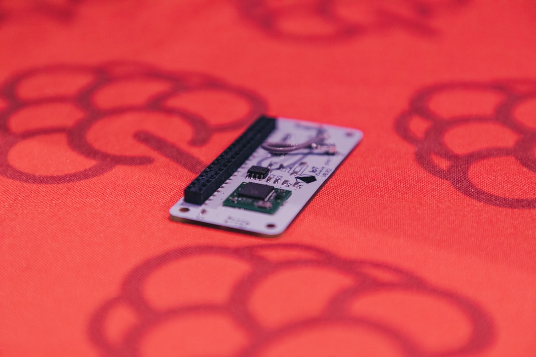 white and black card on red textile